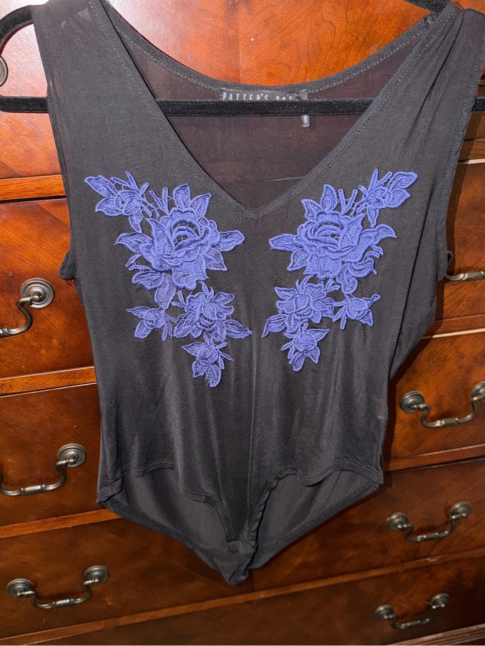 Black V-Neck Bodysuit with Blue Floral Appliqué
